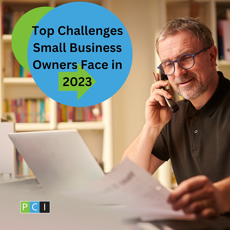 A mature man smiles while talking on the phone, using a laptop and consulting documents, with a graphic stating "top challenges small business owners face in 2023.