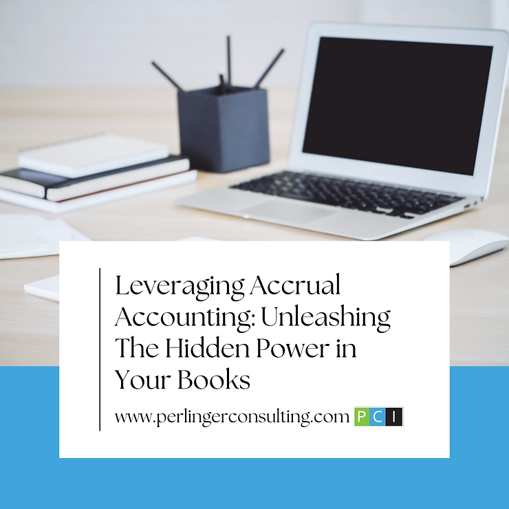 A professional office setup with a laptop open on a desk, surrounded by books and a pencil holder, displaying a slide titled "leveraging accrual accounting: unleashing your hidden power".