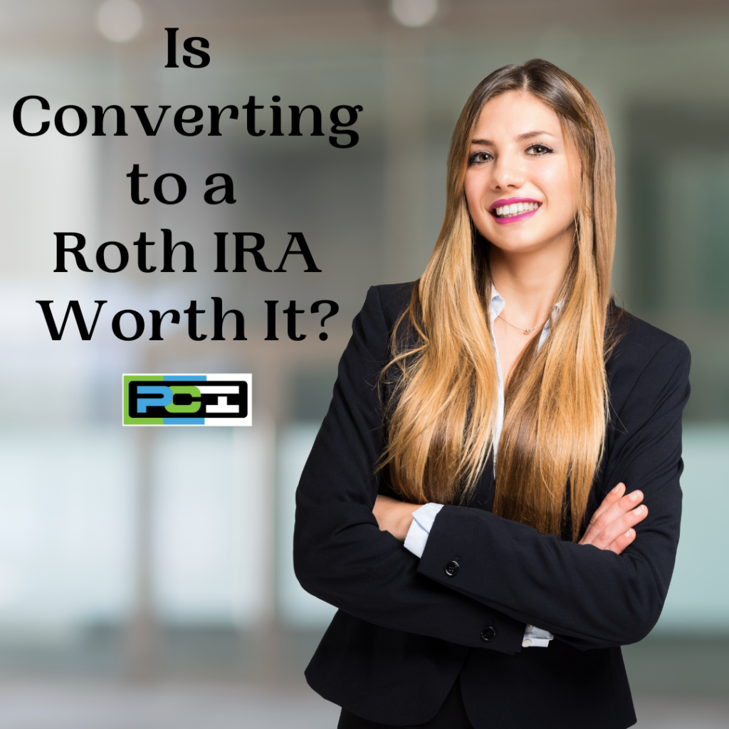 A woman who is a small business owner in an office setting stands in front of verbiage that reads "Is converting to a Roth IRA worth it?"