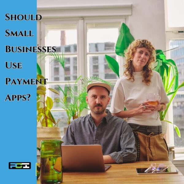 Two small business owners in Littleton, CO reviewing payment apps on a laptop—bookkeeping for small business and QuickBooks consulting support.