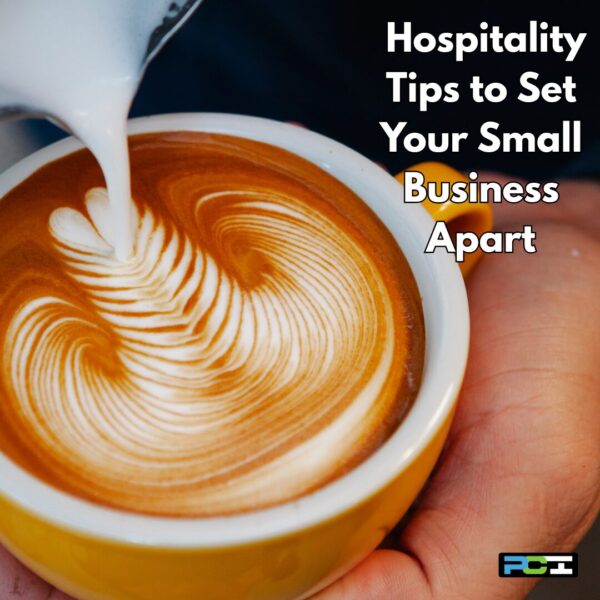 Close-up of milk poured into a latte, creating feathered art in a yellow cup. On-image text says “Hospitality Tips to Set Your Small Business Apart,” PCI logo at bottom right.