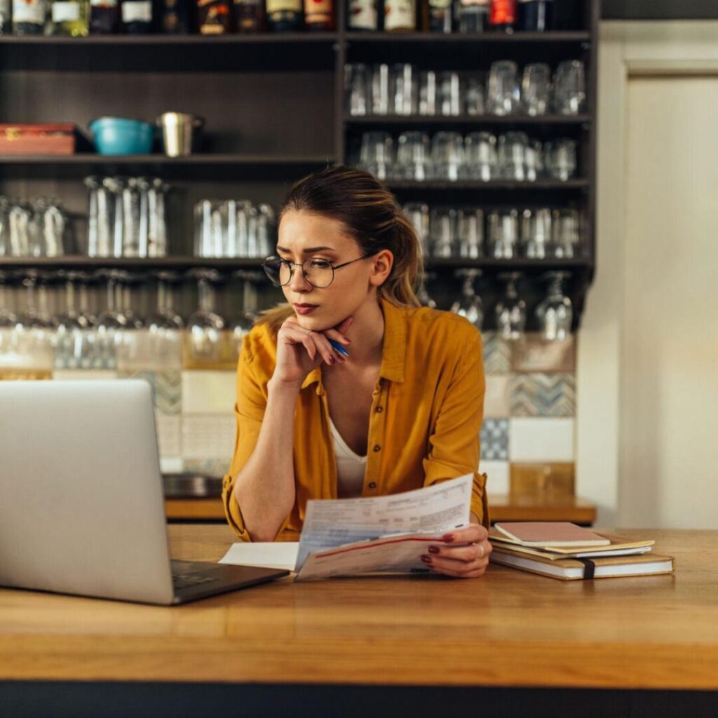 Small Business owner at her computer, reviewing the list of information she will send over to her bookkeerer at Perlinger Consulting.